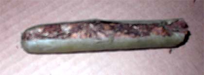 Slicing open the blunt and discarding the inner tobacco substitute, so that marijuana can be inserted to make the final blunt as a marijuana smoking device.