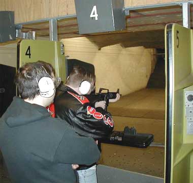 writer jon konrath wielding an m16 in defense of literary integrity